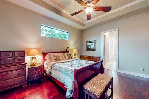 a bedroom with a bed and a ceiling fan at Palm & Friends Estate in Cape Coral
