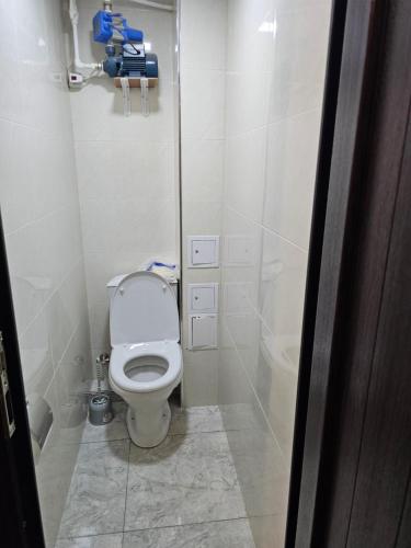 a small bathroom with a toilet in a stall at Квартира отдыха in Ijevan