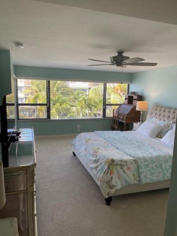 a bedroom with a bed and a ceiling fan at Beacon Reef 307 in Islamorada