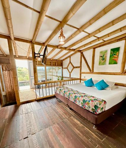 a bedroom with a bed in a room at Eco Hotel Terrabella in Santa Elena