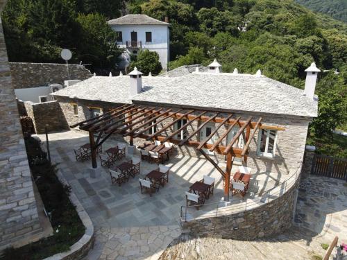 an aerial view of a house with a wooden deck at Nostos Country House in Tsagarada