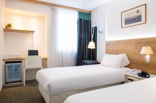 Una cama o camas en una habitación de Mercure Hotel Forbach Centre de Loisirs