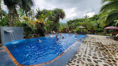 a group of people in a pool at a resort at Hotel Kokoro Mineral Hot Springs in Fortuna