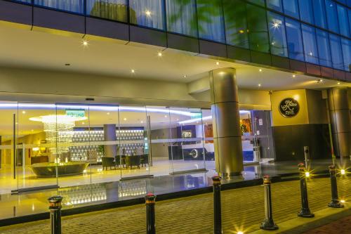 a large building with a shopping mall with lights at Jose Antonio Deluxe in Lima