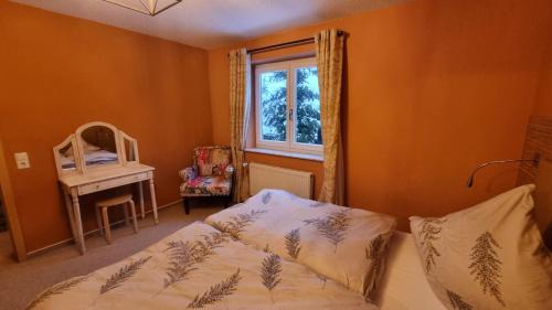 a bedroom with a bed and a window at Creating Memories in Titisee-Neustadt
