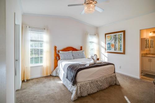 a bedroom with a bed and a ceiling fan at Moore Haven Getaway with Deck and Private Pool in Moore Haven