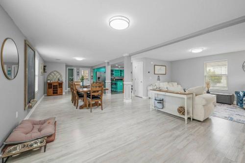 a large living room with a dining room and a kitchen at The Chesapeake St Retreat - Pet and Kid Friendly in Norfolk