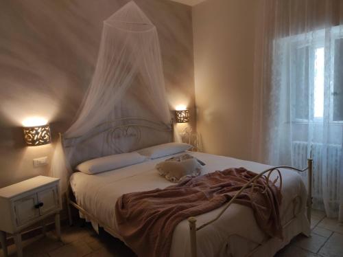 Postel nebo postele na pokoji v ubytování Lo splendore dei Sassi