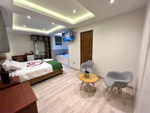 Cama ou camas em um quarto em EL ALAMO, EJECUTIVO Y SPA