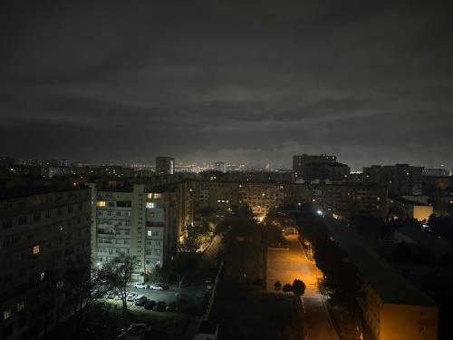 a view of a city at night with lights at Ahmedli in Baku