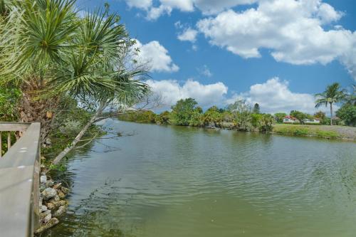 a river with palm trees on the side of it at Sandpebble 4c in Sanibel