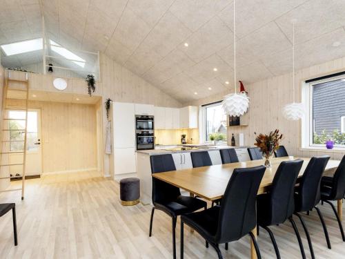 a dining room and kitchen with a table and chairs at Modern Oasis in Marielyst - By Traum Ferienwohnungen in Marielyst