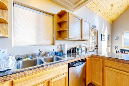 a kitchen with a sink and a dishwasher at Peter's Place in Angel Fire