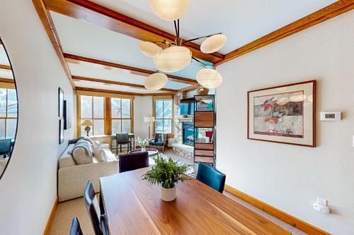 a dining room and living room with a table and chairs at Palmyra 4E in Telluride