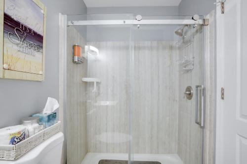 a shower with a glass door in a bathroom at Remodeled Ocean City Getaway with Harbor Views! in Ocean City