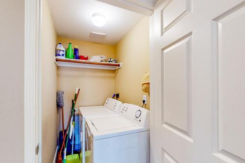 a laundry room with a washer and dryer at Betty's Beach House in Galveston