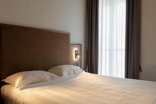 Lo Stemma Luxury Boutique Hotelにあるベッド