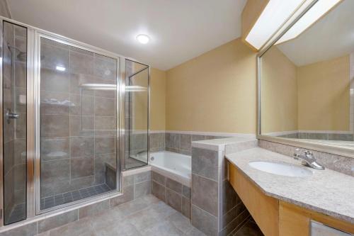 a bathroom with a shower and a sink at Best Western Circus City Inn in Peru