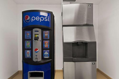 a pepsi machine next to a water dispenser at Best Western Port St. Lucie in Port Saint Lucie