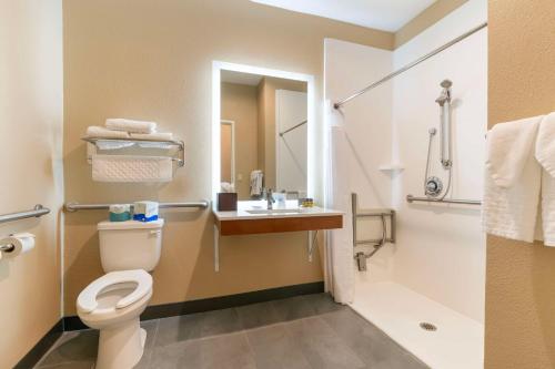 a bathroom with a toilet and a sink at Best Western Bend North in Bend
