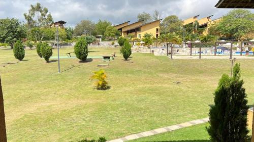a park with a playground with trees in it at FLAT GRAVATÁ WINTERVILLE 1214 in Gravatá