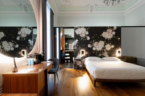 Postel nebo postele na pokoji v ubytování Lo Stemma Luxury Boutique Hotel