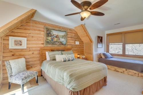 a bedroom with a bed and a ceiling fan at Big Bear Lodge - Cabin in Massanutten Resort! in McGaheysville