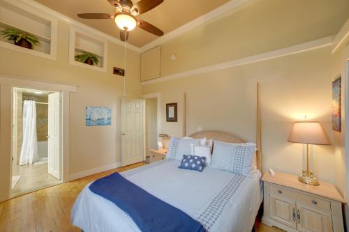 a bedroom with a large bed with blue pillows at Updated Apt 1 Block to Water St and Kalamazoo River in Saugatuck
