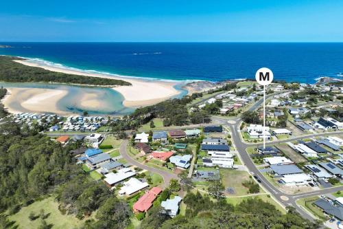 an aerial view of a suburb next to a beach at Tipsy Turtle Beach House in Burrill Lake