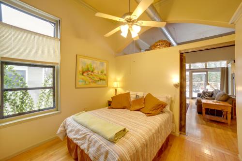 a bedroom with a bed and a ceiling fan at Charming Saugatuck Condo with Private Deck and Grill! in Saugatuck