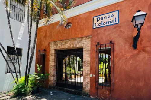 an orange building with a sign that reads passage colonial at Paseo Colonial - Sabbatical #1 in Santo Domingo