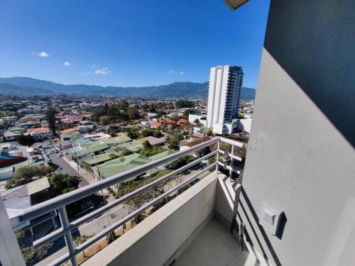a balcony with a view of a city at 1001 Torres Los Yoses Apartamento con A/C y parqueo full equipado in San José