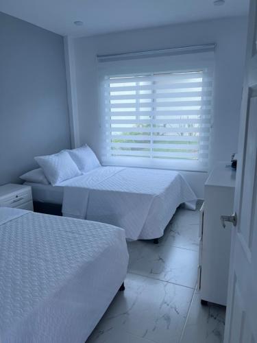 Postel nebo postele na pokoji v ubytování Compostela Cabañas Gigante