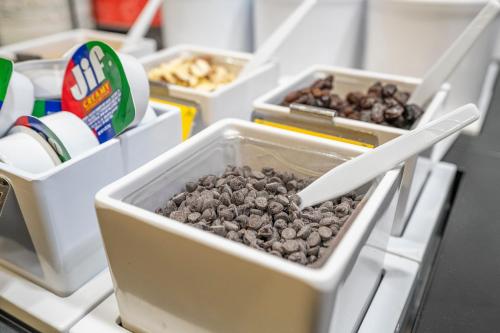 a group of containers of food in a refrigerator at Hampton Inn by Hilton Spring Hill in Timber Pines