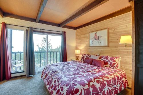 a bedroom with a large bed and a balcony at Stateline Townhome Less Than 1 Mi to Heavenly Ski Lifts in Stateline