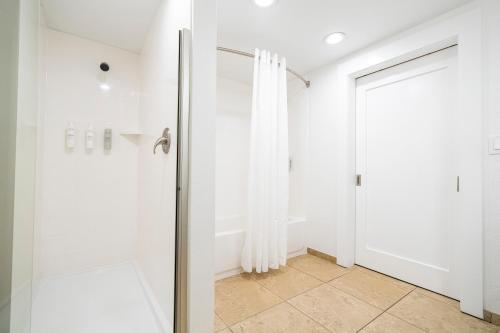 a bathroom with a shower and a glass door at Hampton Inn by Hilton Spring Hill in Timber Pines