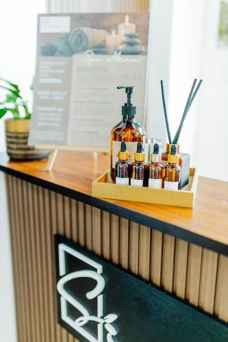 a counter with a bottle of alcohol on a shelf at Spacio Caliraya Bed & Breakfast in Lumban