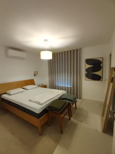 Katil atau katil-katil dalam bilik di Superacao Ferragudo Flat River View