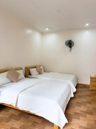 Ένα ή περισσότερα κρεβάτια σε δωμάτιο στο GOLDEN LAND HOTEL