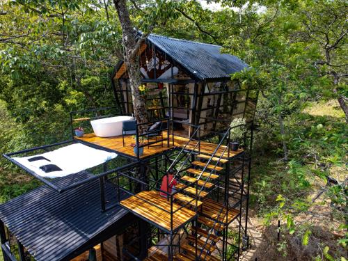 a tree house in the middle of a forest at Tree House Glamping in Yopal