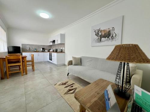 a living room with a couch and a table at AuobCorner in Walvis Bay