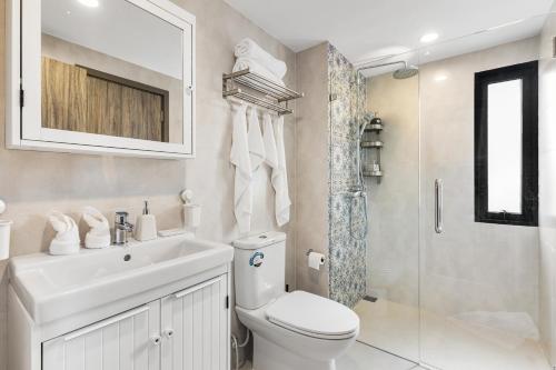 a bathroom with a toilet and a sink and a shower at Bright Apartment Close to Amazing Beach ! 39 Sqm in Nai Yang Beach