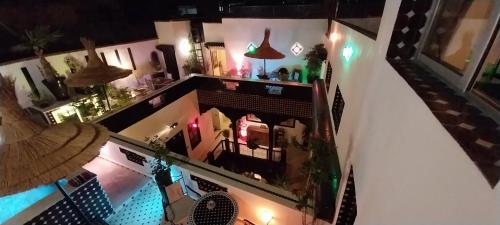 an overhead view of a building with a pool at Dar Najat in Marrakech