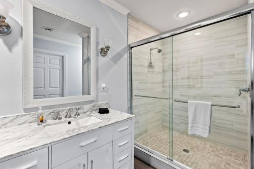 a bathroom with a shower and a sink at Bologna Golf Condo in the Lely Resort in Naples