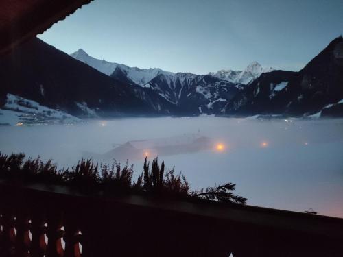 a view of a lake in the mountains at dusk at Apartment Mayrhofen near Horbergbahn in Hippach