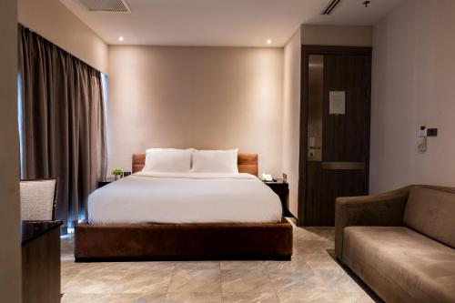 Katil atau katil-katil dalam bilik di Sukhothai Hotel and Residence