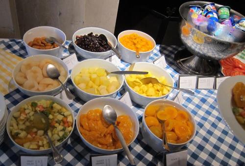 a table topped with bowls of different types of food at JustV14 in Mahikeng