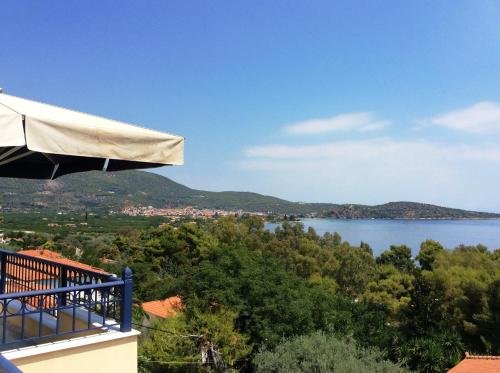 a view of a lake from the balcony of a house at Angelica Villas Hotel Apartments in Ancient Epidauros