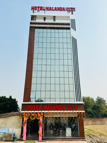 a hotel malawi city with a sign in front of it at Hotel Nalanda City in Nalanda