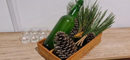 a wooden container with pine cones and wine glasses at La Casina de Barreo Avilés 